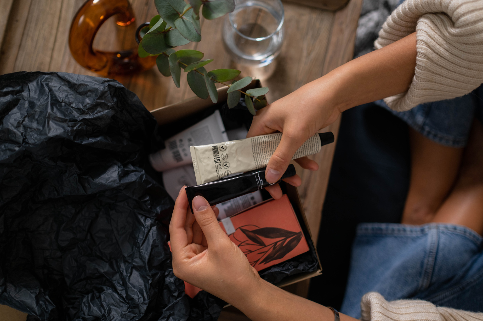 Person Unboxing the Face Creams